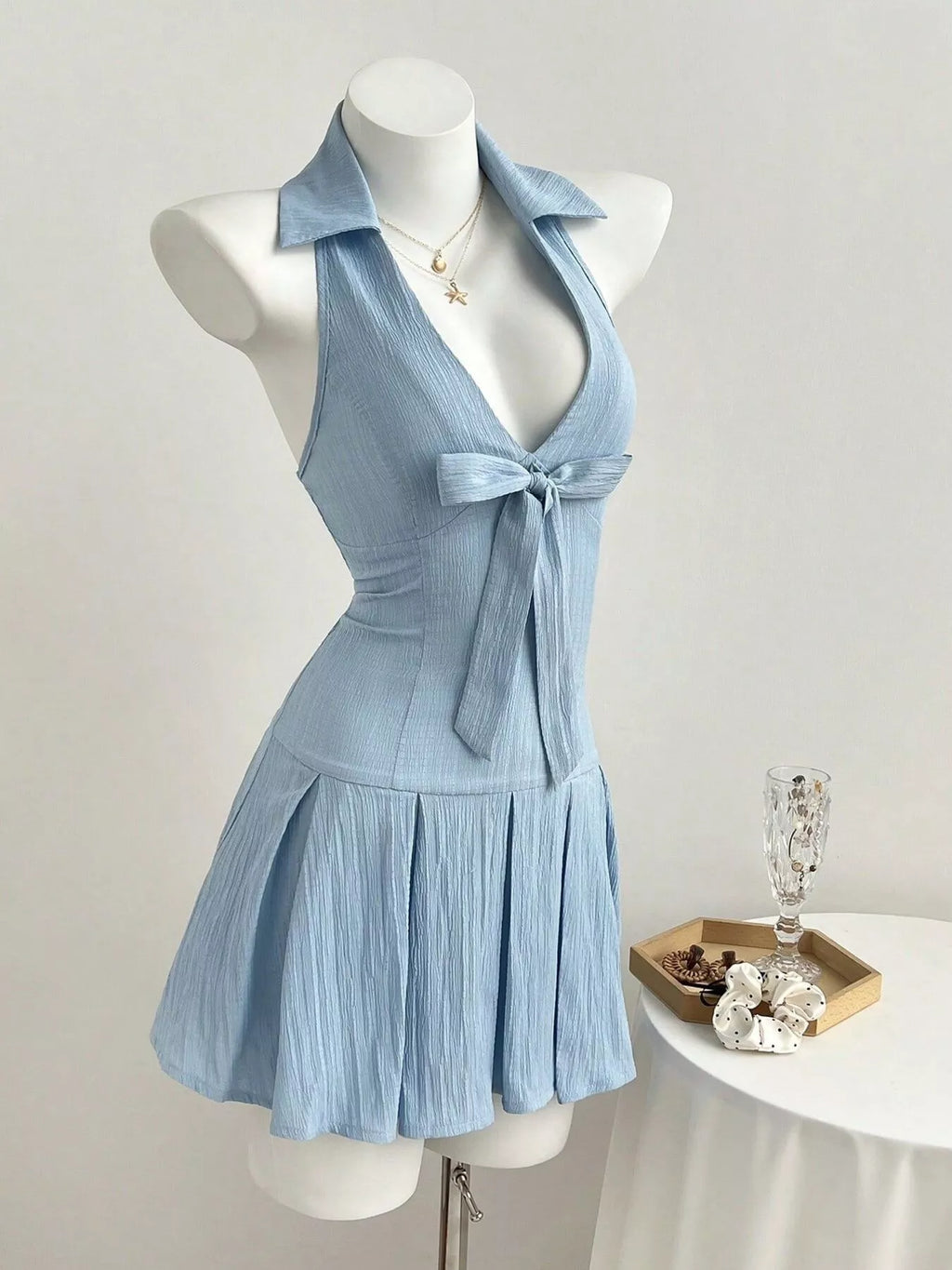 YSONA Halter Neck Bow Tie Pleated Mini Dress — model wearing | Women's Dress | Shop YSONA