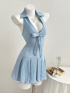 YSONA Halter Neck Bow Tie Pleated Mini Dress — model wearing | Women's Dress | Shop YSONA